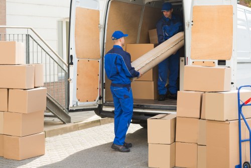 Team member loading items safely into a van