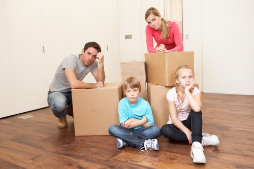 Local movers handling furniture near Colliers Wood flats and apartments
