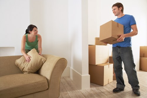 Loading bulky furniture for pick-up in a South West London street