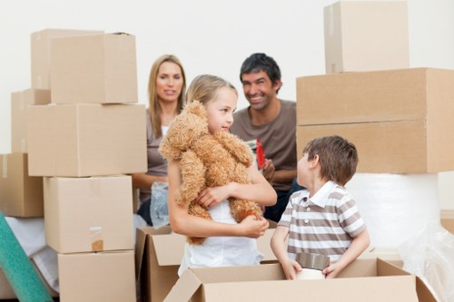 Professional movers handling furniture during a local removals job in Colliers Wood